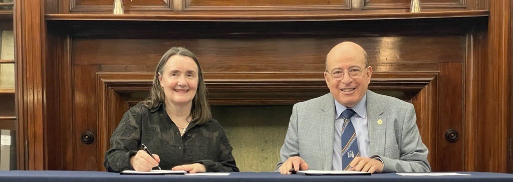 Professor Mary Joan Macleod, Chair of SHARP, and Professor Hany Eteiba, College President, sign the MoU